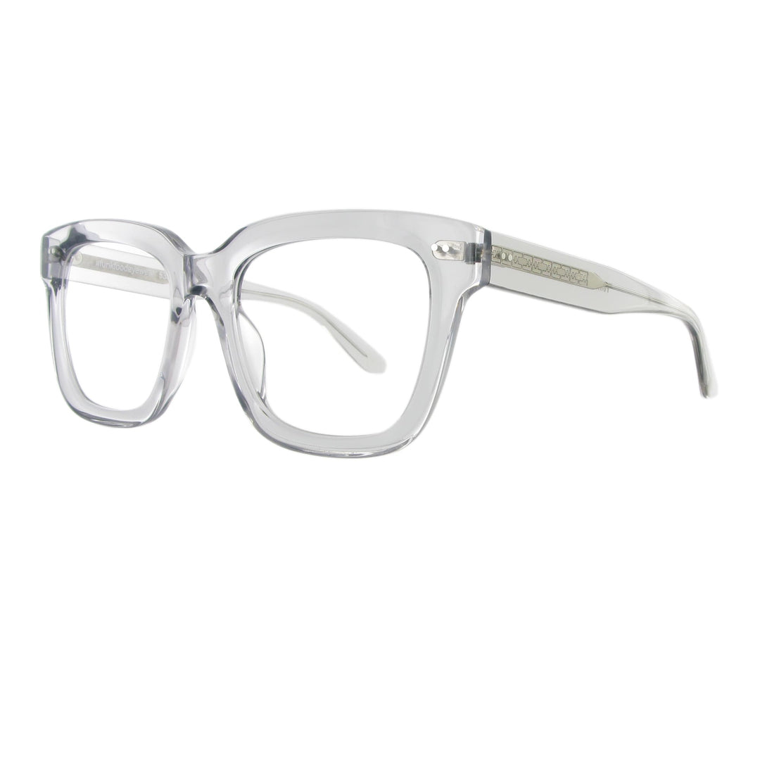 Markante transparente Acetatbrille mit dickem Gestell und silberfarbener Bügelseele.